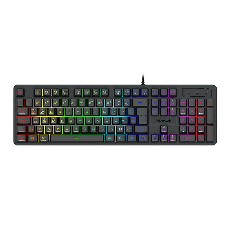 Teclado Gamer Redragon Netherbane Rainbow com iluminação vibrante em um setup de jogos, mostrando as teclas mecânicas e o design robusto. A imagem destaca as cores do arco-íris nas fileiras de teclas e o cabo trançado USB.